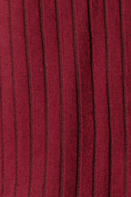 Close-up of red ribbed knit fabric with vertical stripes, apparel textile texture