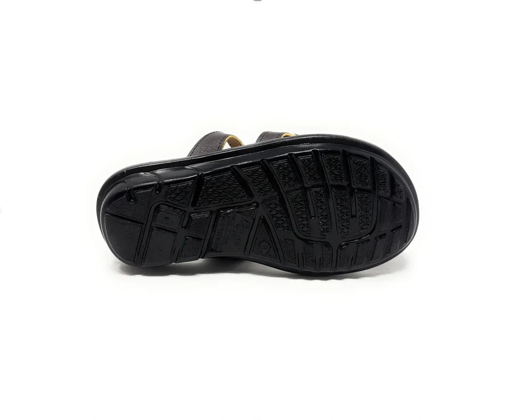Black sandal shoe sole with textured grip on white background