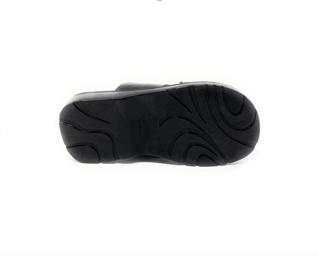 Black shoe with textured non-slip sole, isolated on a white background