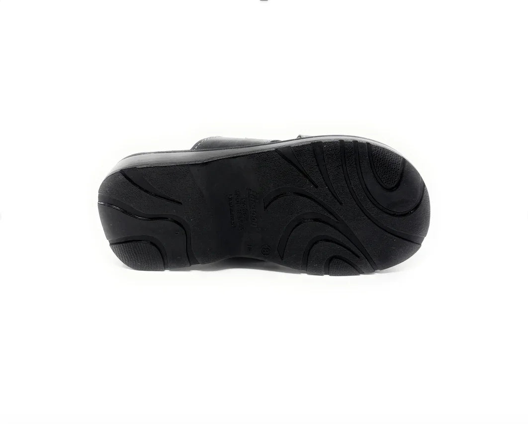 Black shoe with textured non-slip sole, isolated on a white background