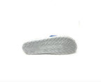 White athletic shoe sole with textured rubber tread, isolated on white background