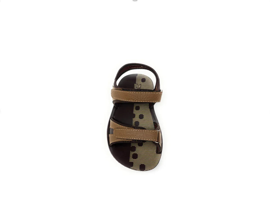 Brown open-toe sandal with adjustable straps and a polka dot footbed, top view