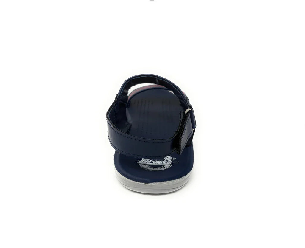 Navy blue children’s sandal with ankle strap, viewed from the back on white background