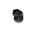 Rear view of a navy blue and gray sandal with adjustable strap and red accents
