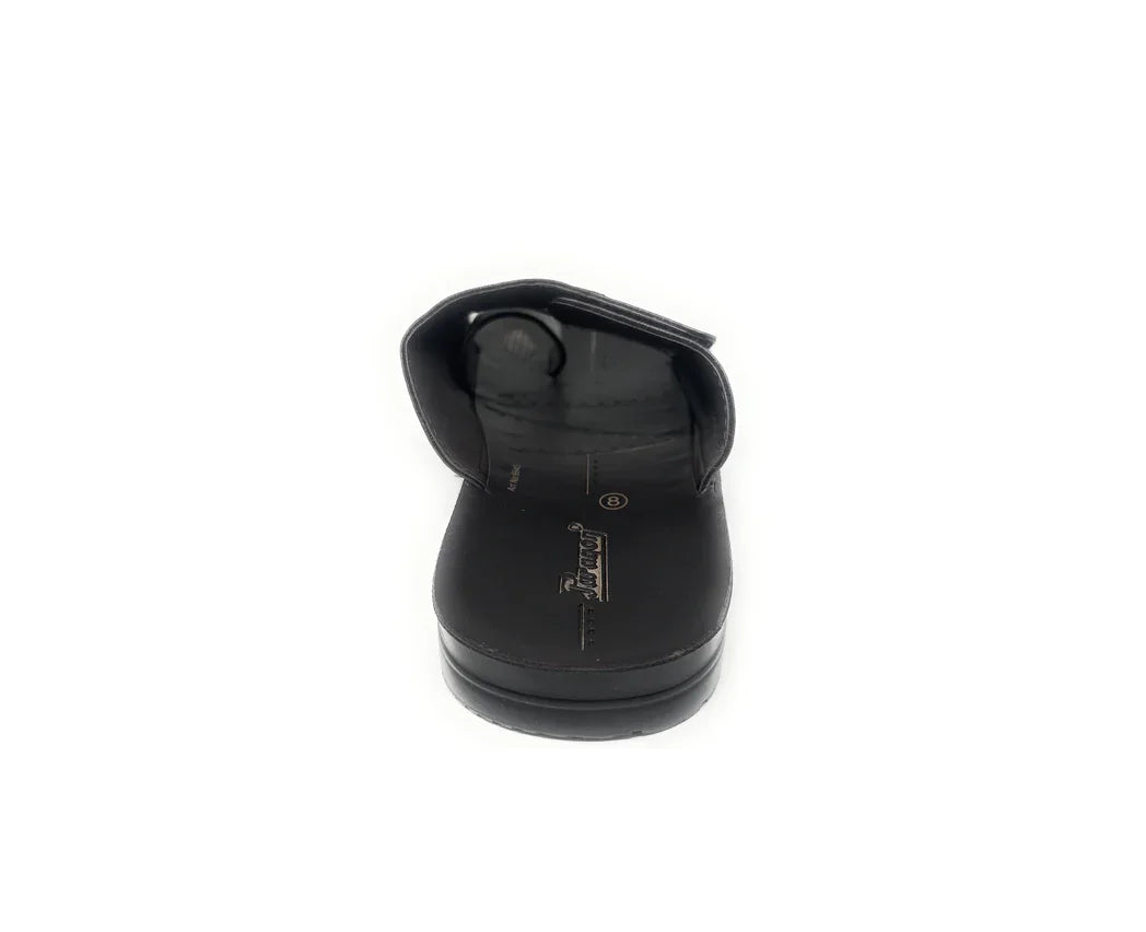 Black slip-on sandal with open toe and adjustable strap, photographed on white background