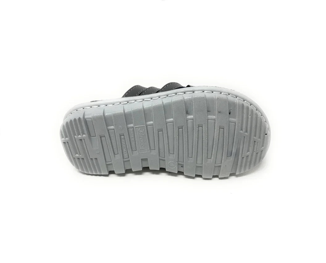 Gray rubber shoe sole with textured tread pattern, isolated on white background