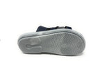 Bottom view of a blue sandal with gray non-slip textured sole on white background