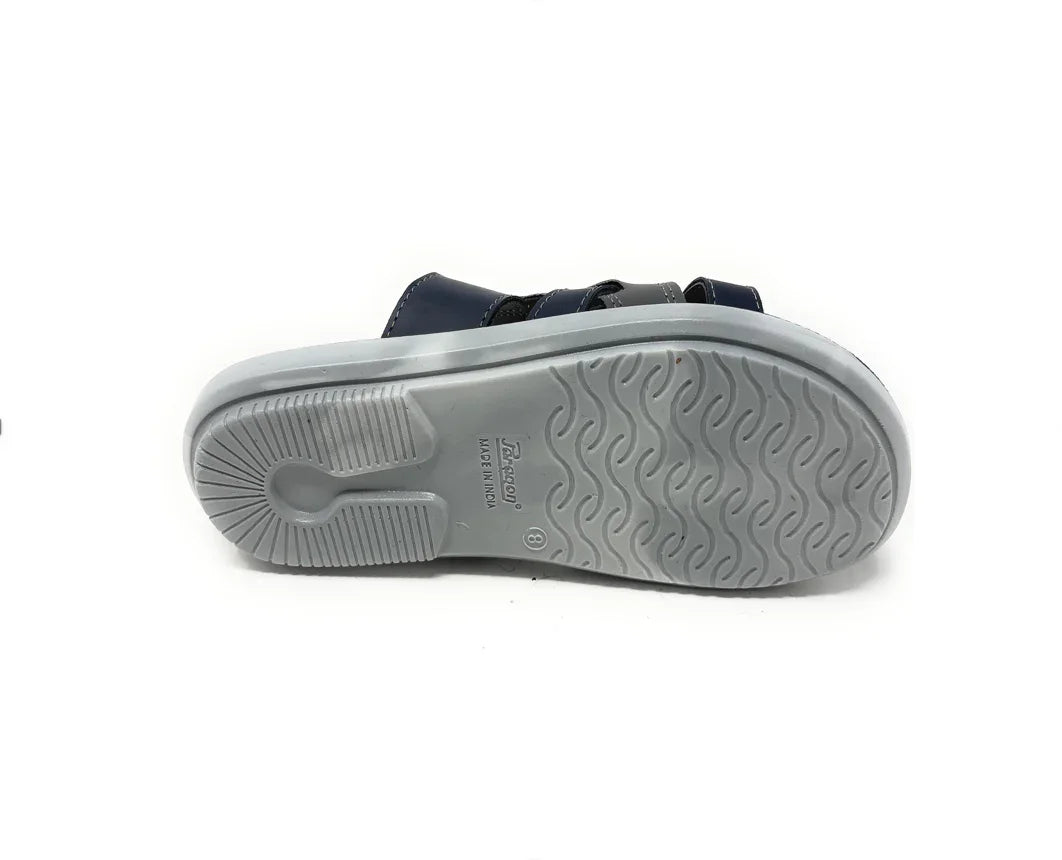 Bottom view of a blue sandal with gray non-slip textured sole on white background