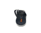Black slip-on sandal with thin straps and textured sole, casual footwear on white background