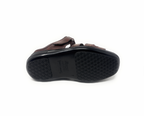 Brown sandal with textured black sole, viewed from the bottom on white background