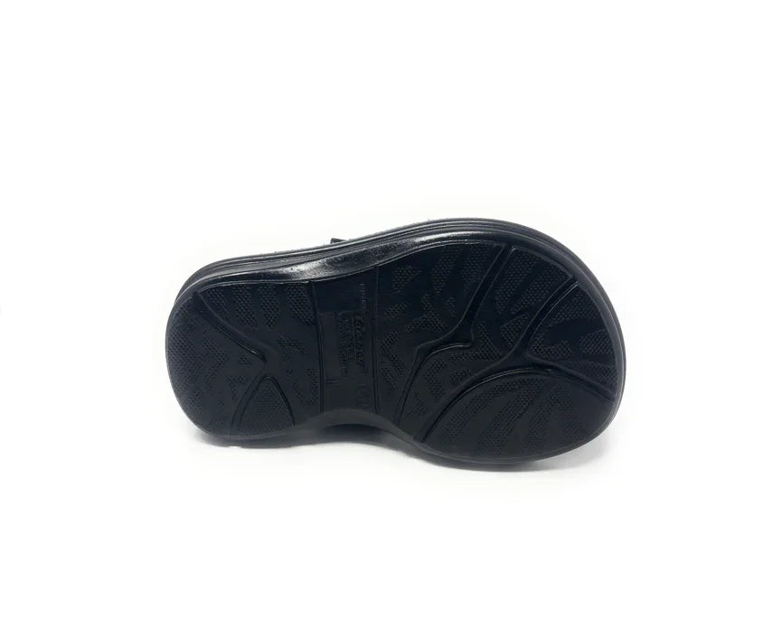 Black rubber shoe sole with textured, non-slip grip on white background