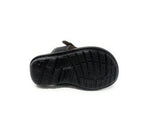 Black sandal with textured rubber sole, durable grip design, isolated on white background