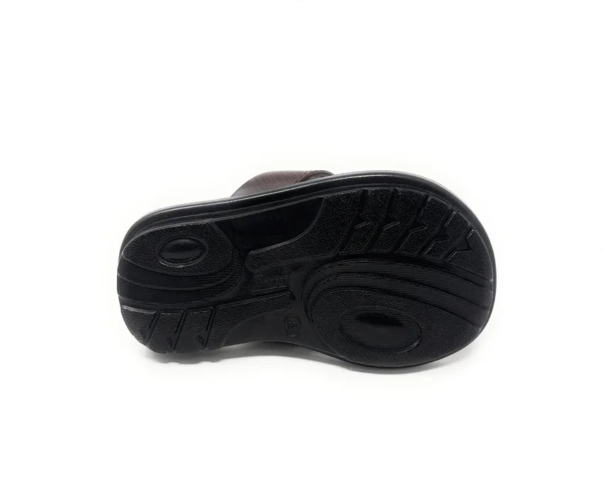 Black rubber shoe sole with textured tread pattern on white background