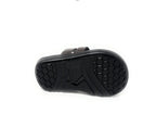 Black sandal with non-slip rubber sole and hexagonal tread pattern on white background