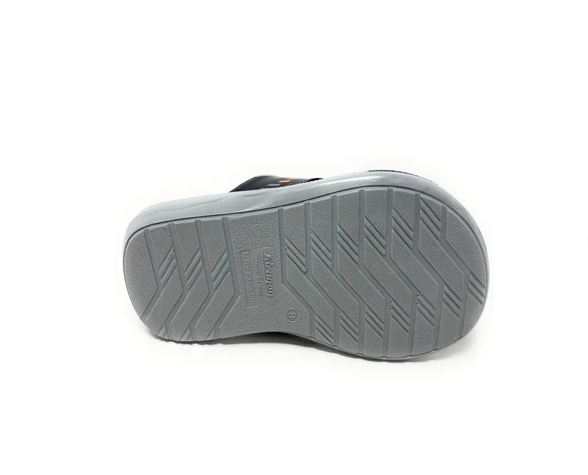 Close-up of a gray sandal sole with textured grip pattern on a white background