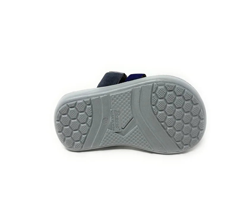 Sandal with gray hexagonal textured sole and navy straps, isolated on white background