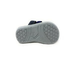Sandal with gray hexagonal textured sole and navy straps, isolated on white background