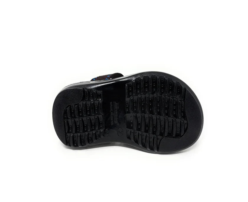 Black rubber sandal sole with textured non-slip grip pattern on white background