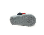Gray rubber sandal sole with honeycomb tread pattern, navy and red strap visible on top