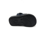 Black sandal sole with non-slip tread pattern on white background