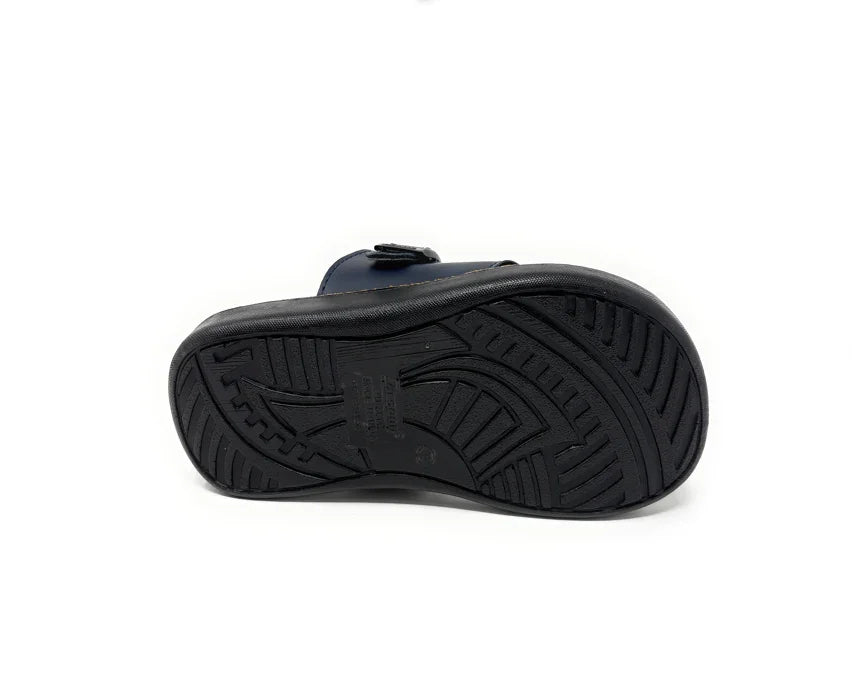 Black sandal sole with non-slip tread pattern on white background